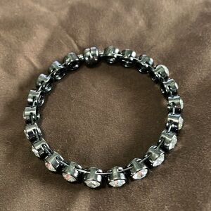 Black metal bracelet with clear stones